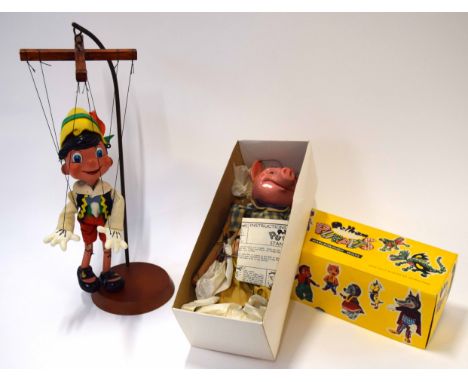 Vintage boxed Pelham puppet of a pig together with a further puppet on wooden and metal display stand
