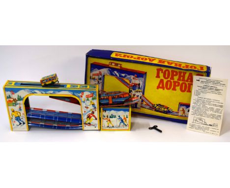 Vintage 1960s Russian tin plate clockwork skiing toy in original box with instructions