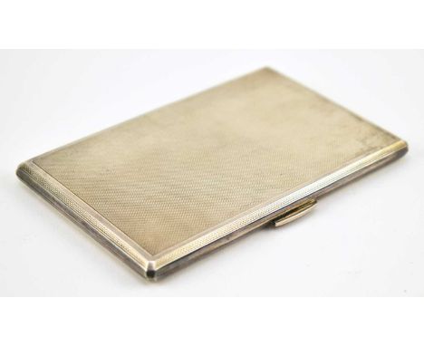 A hallmarked silver cigarette case. Engine turned decoration to front and back. Hallmarked year 1960 Birmingham. Sponsors mar