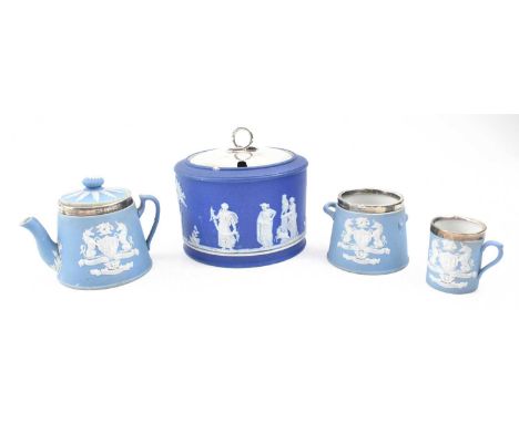 A collection of four Wedgwood Jasperware silver mounted items. The lot to include a dark blue Jasperware pot with hallmarked 
