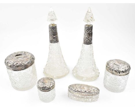 A collection of six hallmarked silver &amp; glass dressing table set. The lot to a large hallmarked silver lidded vanity bott
