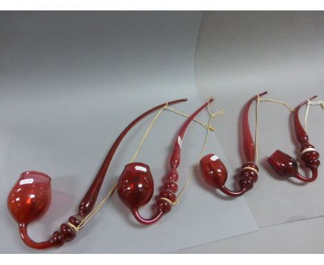 Four 19th century Ruby Red Nailsea Glass Pipes