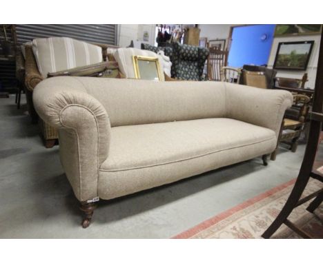 Victorian Chesterfield Sofa upholstered in Herringbone Tweed raised on four turned feet and castors