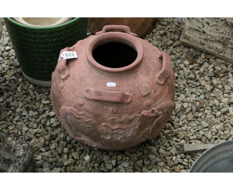 Terracotta vase / planter of circular form, with relief dragon decoration and four handles, approx 40cm tall 