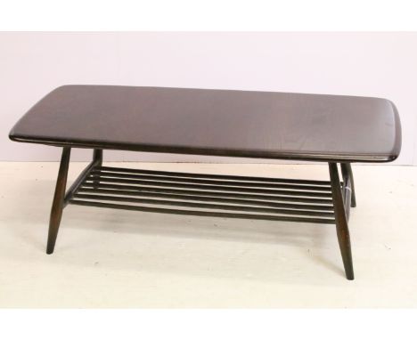Ercol dark wood coffee table, with splindled lower shelf, with maker's label, model 459, 36.5cm high x 104cm wide x 45cm deep