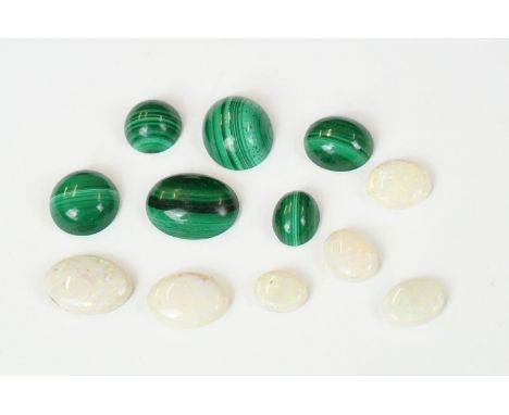 A small collection of opal and malachite polished cobochons. 