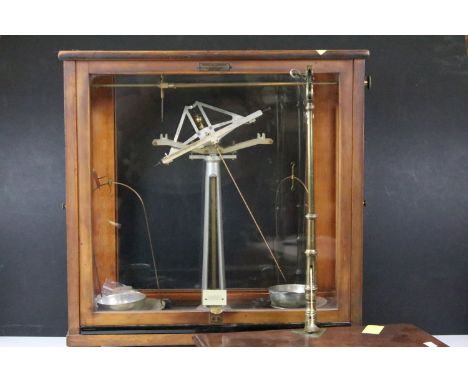 Pair of L Oertling London balance scales in wooden and glass case together with a set of Stevens &amp; Son balance scales wit