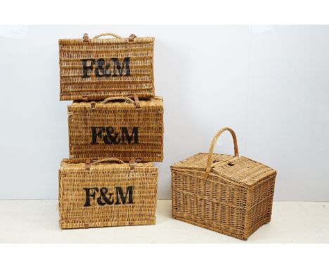 Three Fortnum &amp; Mason wicker picnic hampers with leather fastening strap (approx 53cm wide), together with a further wick
