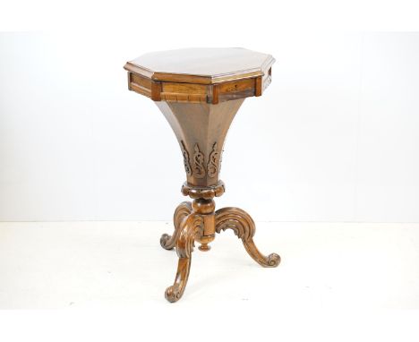 Victorian rosewood octagonal work table, with elaborately carved column and tripod base with scroll feet, 72cm high x 44cm wi