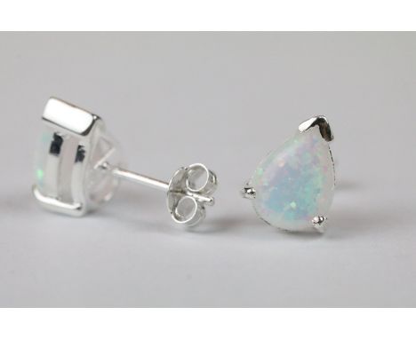Pair of silver and pear shaped opal stud earrings 
