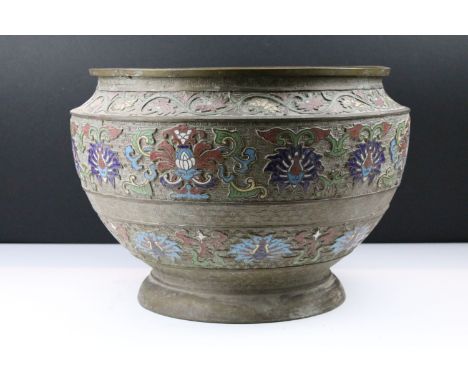 Chinese champleve planter having moulded greek key design with enamelled floral sprays throughout, raised on a footed base. M