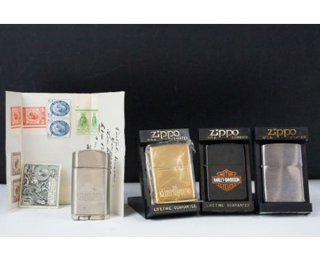 A collection of four pocket lighters to include three Zippo examples together with a selection of stamps. 