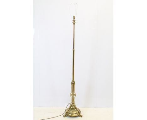 Brass standard lamp, with tripod base and scroll feet, 149.5cm high 