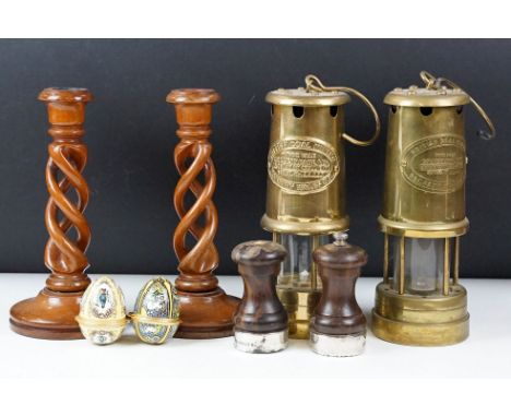Two 'British Coal Mining' brass miners lamps, together with a pair of barley twist wooden candlesticks (approx 21cm tall), si