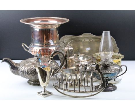 Collection of silver plated to include champagne bucket, muffin warmer, wine coaster, oil lamp, gondola toast rack and tray. 