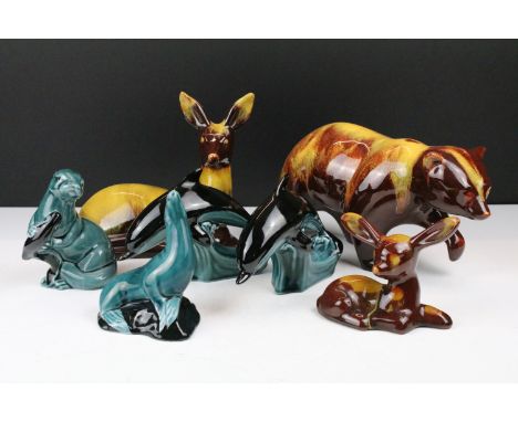 Three Blue Mountain brown animal figures to include a large bear, together with four pieces of Poole Pottery 