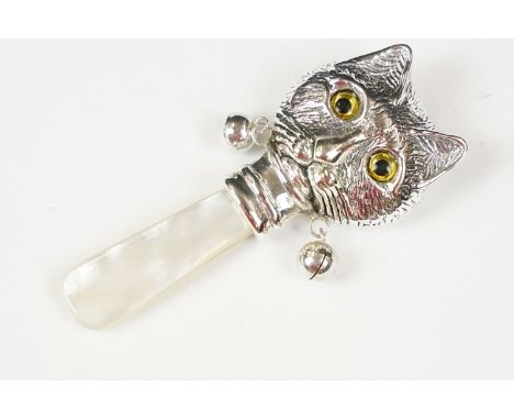 Silver babies rattle with mother of pearl handle in the form of a cat 