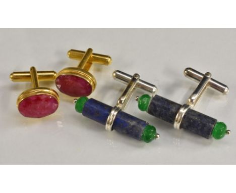 A pair of lapis lazuli and emerald cufflinks, tubular lapis lazuli bar capped either end with a faceted emerald bead, unmarke