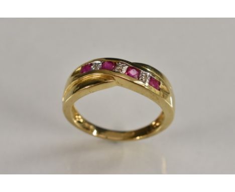 A ruby and diamond seven stone ring, alternate set with four oval ruby's and three round diamond accents, 9ct gold shank, sta