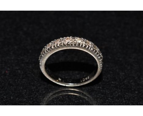 A diamond half eternity ring, linear set with ten round cut diamond accents, total estimated diamond weight approx, 0.28ct, 1