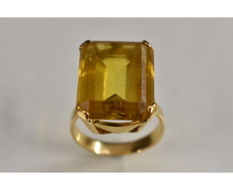 A yellow topaz dress ring, single rectangular cut vibrant yellow topaz, measuring 16.9 x 13.1 x 6.89 mm,, approx weight 11.8c