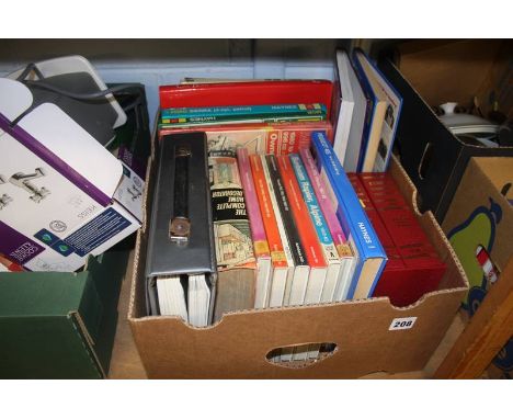 A shelf of miscellaneous, including books and china