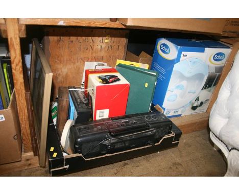 A shelf of miscellaneous, including a Scholl foot spa