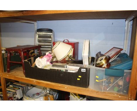 A shelf of miscellaneous, including a Royal Doulton figure and barometer