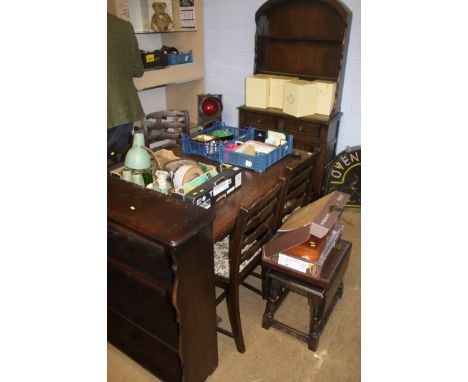 An oak dining room suite, stool, bookcase, tea trolley and a corner cabinet