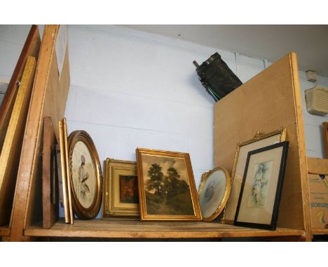 A shelf of framed pictures