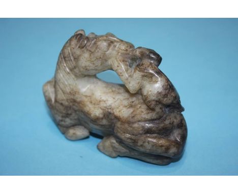 A spinach jade figure group of a monkey riding a horse, 6cm