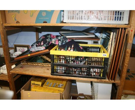 A shelf of miscellaneous, including mirrors and microwave