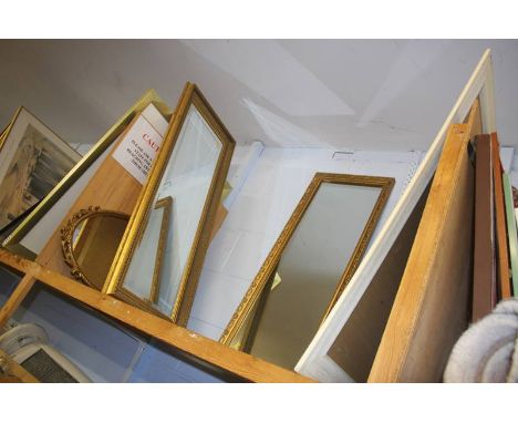 A shelf of four mirrors