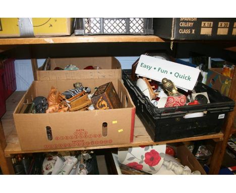 A shelf of miscellaneous items, including a wall clock