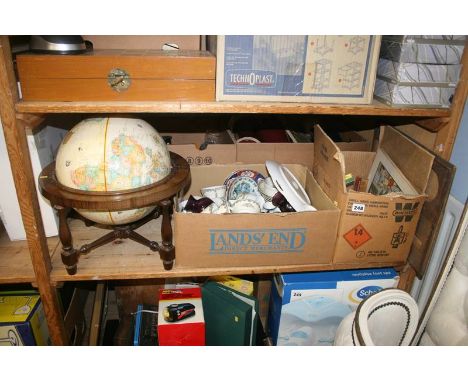 A shelf of miscellaneous including a globe on stand