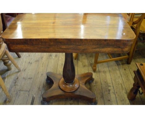 A Rosewood pedestal card table on platform base