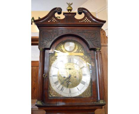 A flamed Mahogany cased longcase clock with two train eight day movement striking on a bell having a Brass 13" dial with silv