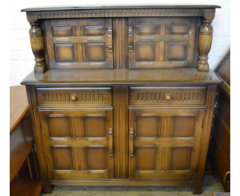 An Ercol dresser and an Oak bureau