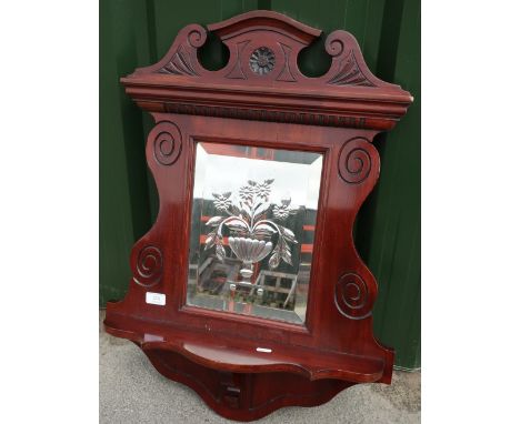 Late Victorian mahogany wall shelf with carved detail to the border and central etched glass bevel edged mirrored panel (55cm