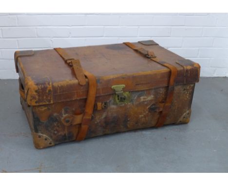 A large brown leather travel trunk, brass fittings,  90 x 34 x 54cm.