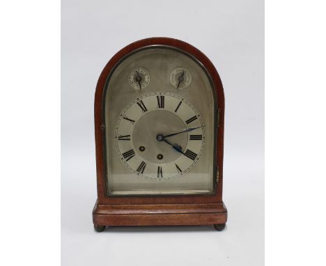 Mahogany bracket clock, with arched silvered roman dial, subsidiary slow/fast and chime/silent dials, 33cm