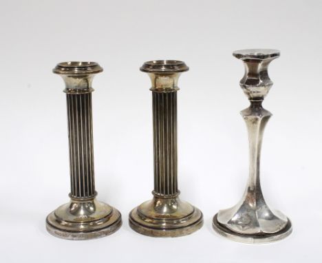 A pair of Continental silver candlesticks and a George V silver candlestick, Birmingham 1916, tallest 17cm, (3)`
