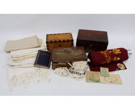 Box containing a mixed lot including three wooden boxes, a roll of embroidered red fabric, some vintage table linens,  etc