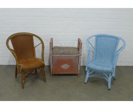 Vintage wicker ware to include two armchairs and  a laundry basket / stool. (3) 