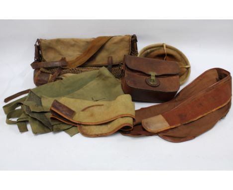 Vintage fishing bags to include canvas and leather, a pair of cloth waders, bags for fishing rods etc (a lot)