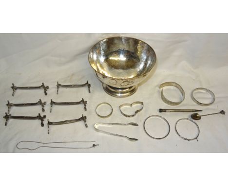 An engine turned silver Pencil, three pairs of Christofle Knife Rests, hammered plated Bowl, Bangles, etc.