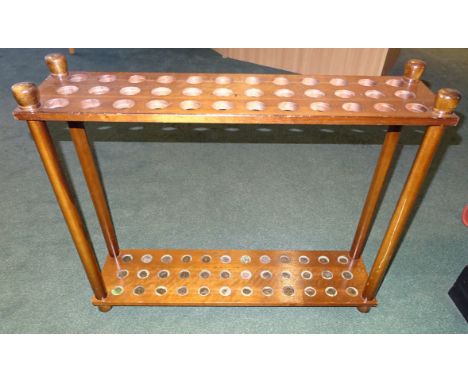 A wooden Stick Stand to hold 36 sticks, 29" (74cms) wide.