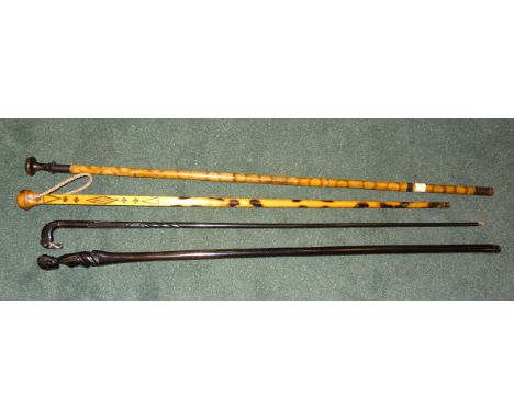 A German Cane with organ stop handle, a Norwegian Stick and two African Sticks.