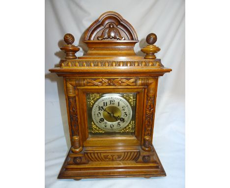An Edwardian Mantle Clock, the German movement with gong strike, steel and brass dial and architectural style walnut case, 17