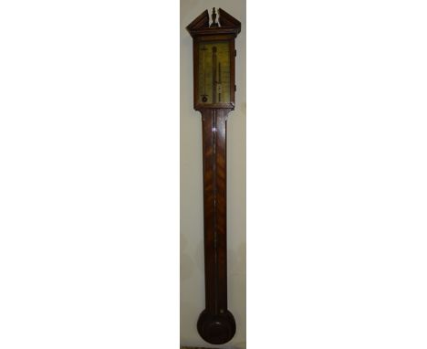 A Stick Barometer with brass register inscribed "T Gobbi & Co" in a mahogany case with broken arch pediment and circular cist